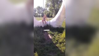 In Flemish Fields Crazy Naked swinging and smashing the camera